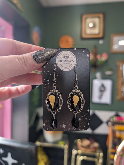 Faux Crow Skull Earrings in Frame